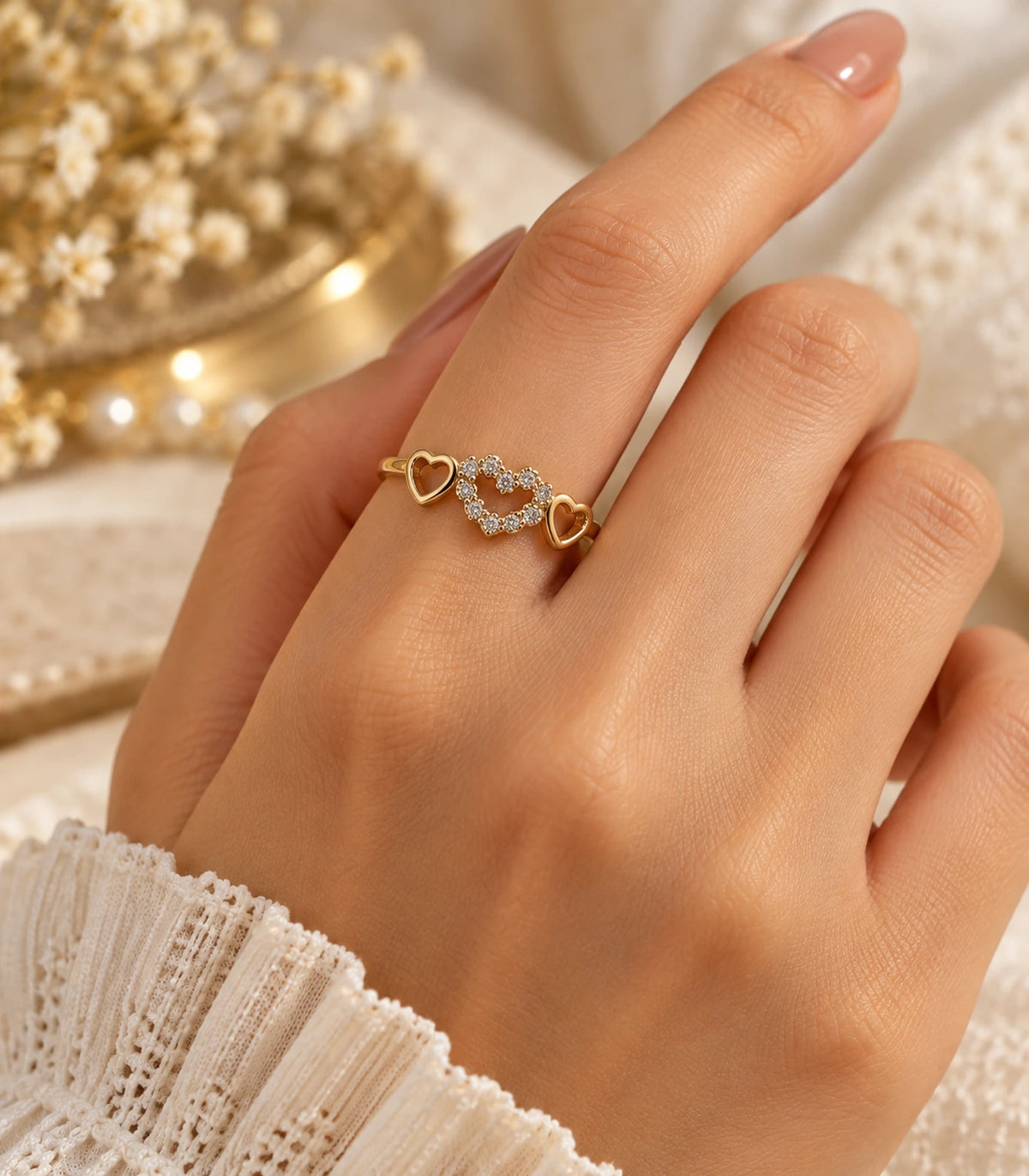 JIMIKI Triple Heart Crystal Adjustable Ring in Gold Tone - editorial worn view #color_gold-tone