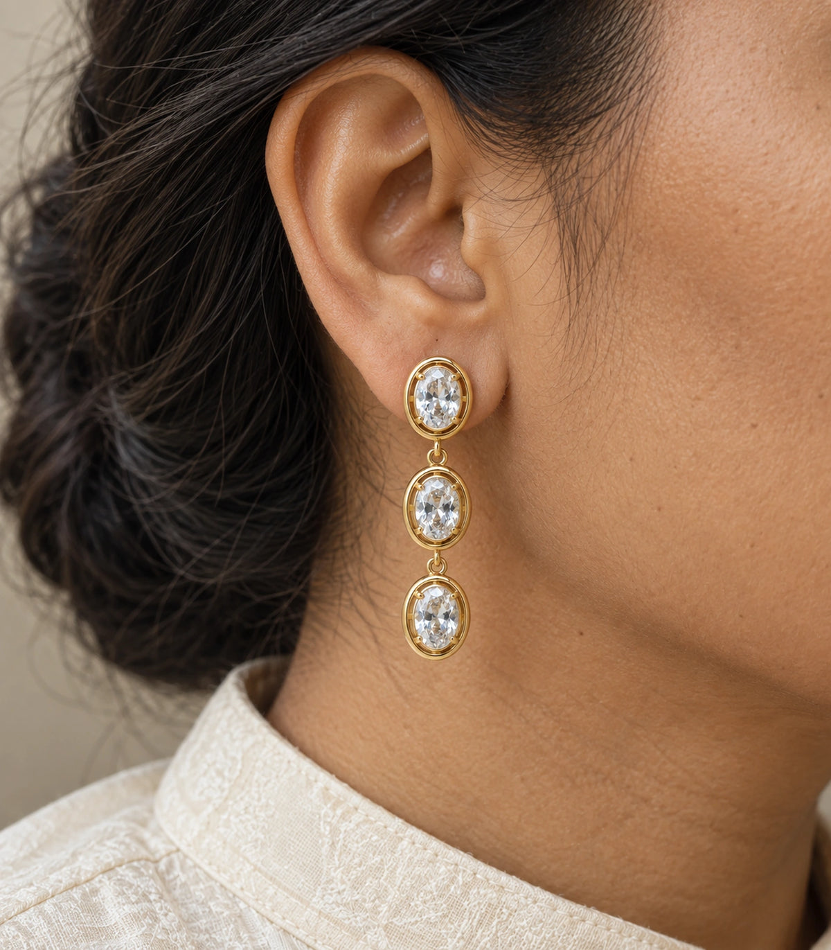 JIMIKI Triple Oval Crystal Drop Earring Pair in Gold tone, close-up detail #color_gold tone