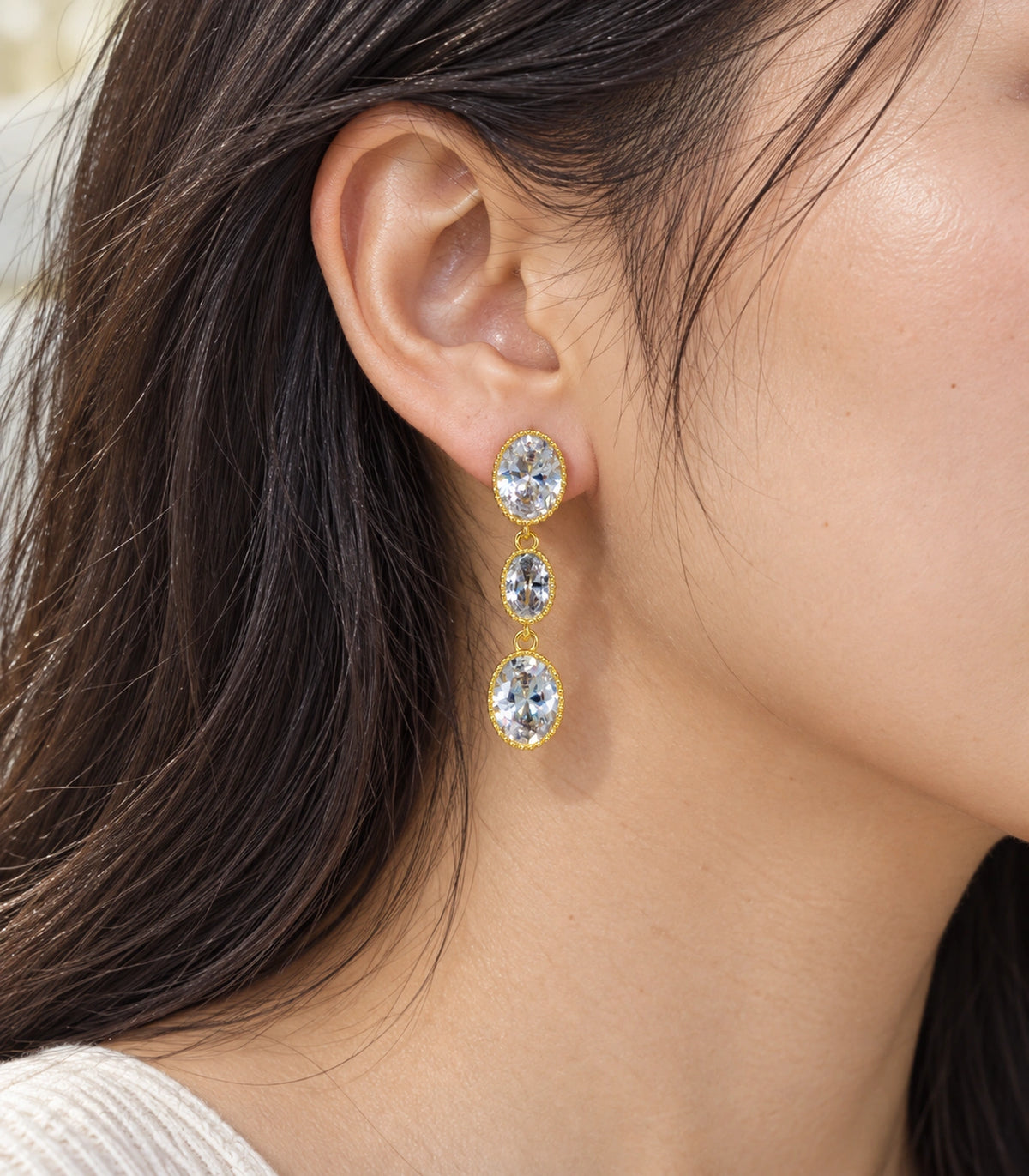 JIMIKI Triple Oval Crystal Drop Earrings in Gold Tone, close-up detail #color_gold tone