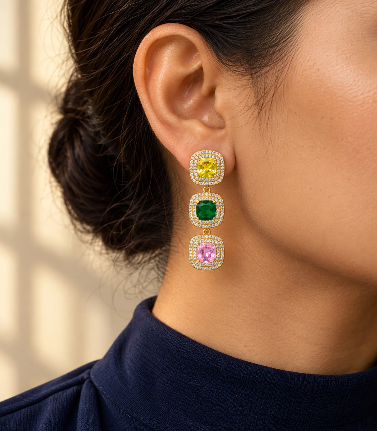 JIMIKI Yellow Green Pink Triple Cushion Halo Drop Earring Pair in Gold tone / yellow, green, pink, editorial model view #color_gold tone / yellow, green, pink