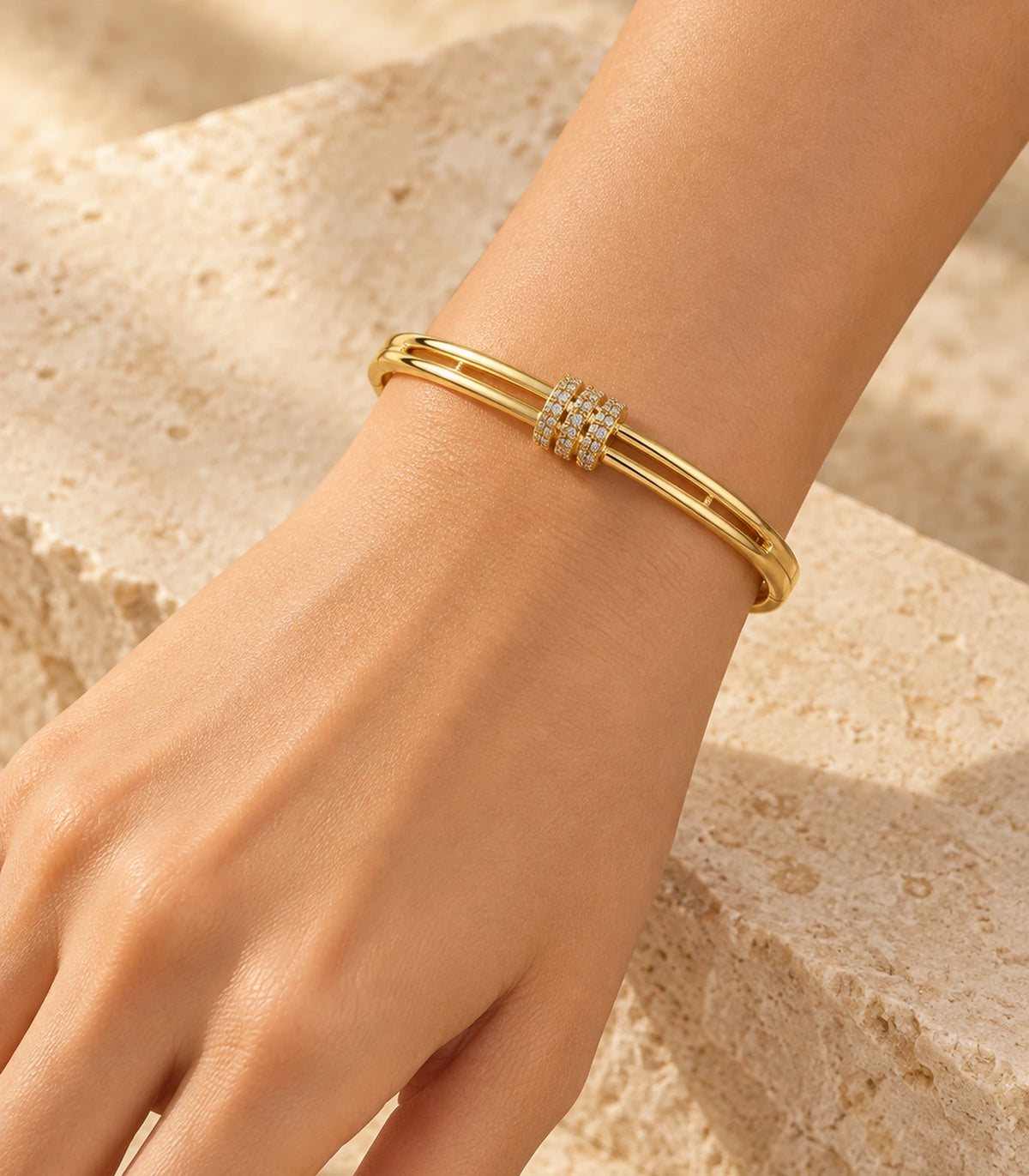 JIMIKI Gold-Tone Triple Pavé Band Double-Rail Bangle — bangle styled with an outfit #color_gold-tone / clear