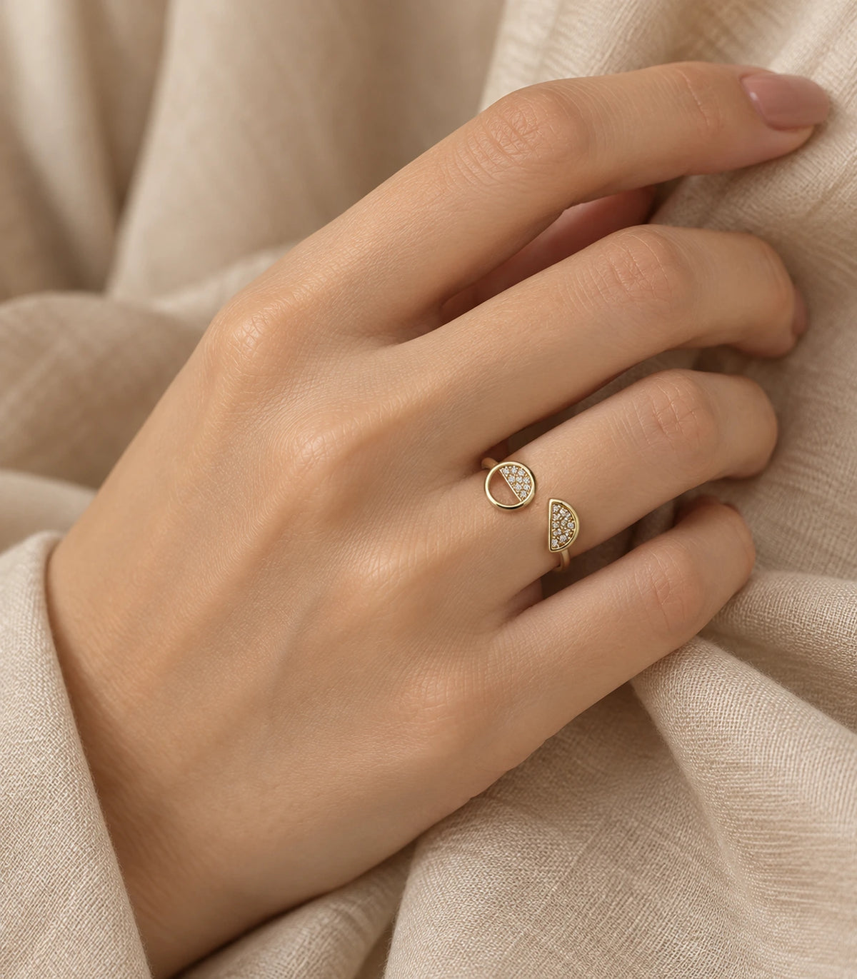 Gold Two-Shape Pavé Open Ring styled on a hand against fabric