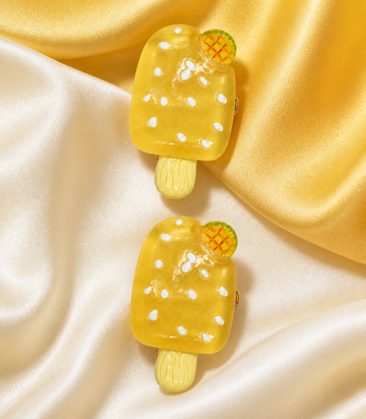 Close-up of the Golden Mango Popsicle Clip Pair details