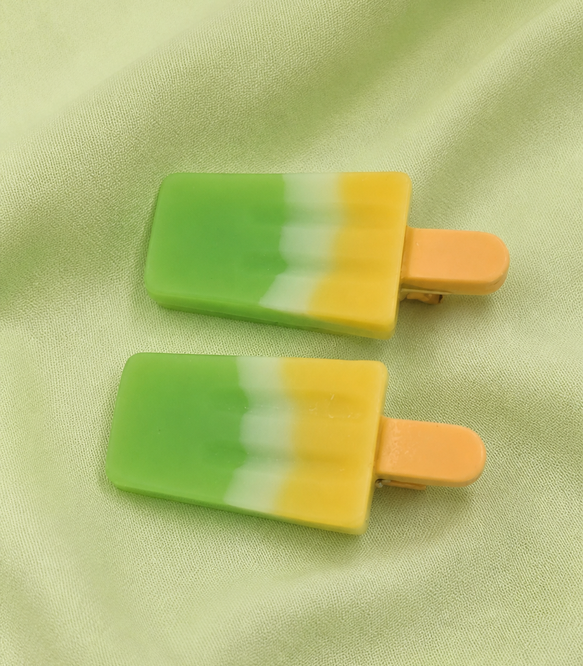 Green Yellow Popsicle Clip Pair in close-up detail
