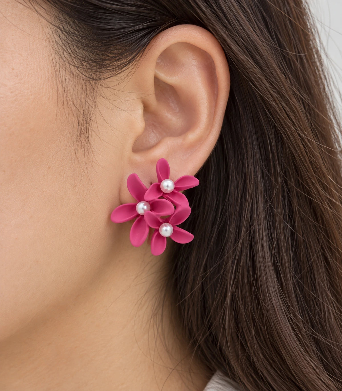 JIMIKI Hot Pink cascading floral cluster stud earrings, close-up of the three pearl-like centres and curved petals #color_hot pink