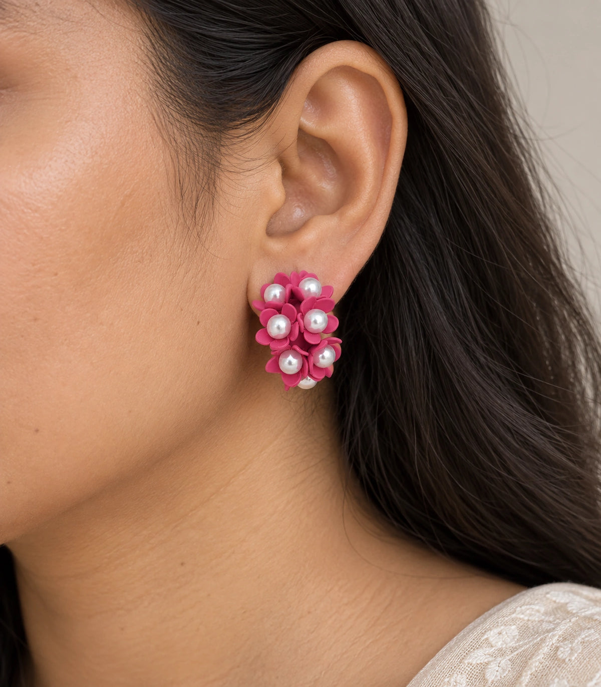 JIMIKI Hot Pink pearl flower hoop earrings, worn on the ear with the floral cluster visible #color_hot pink