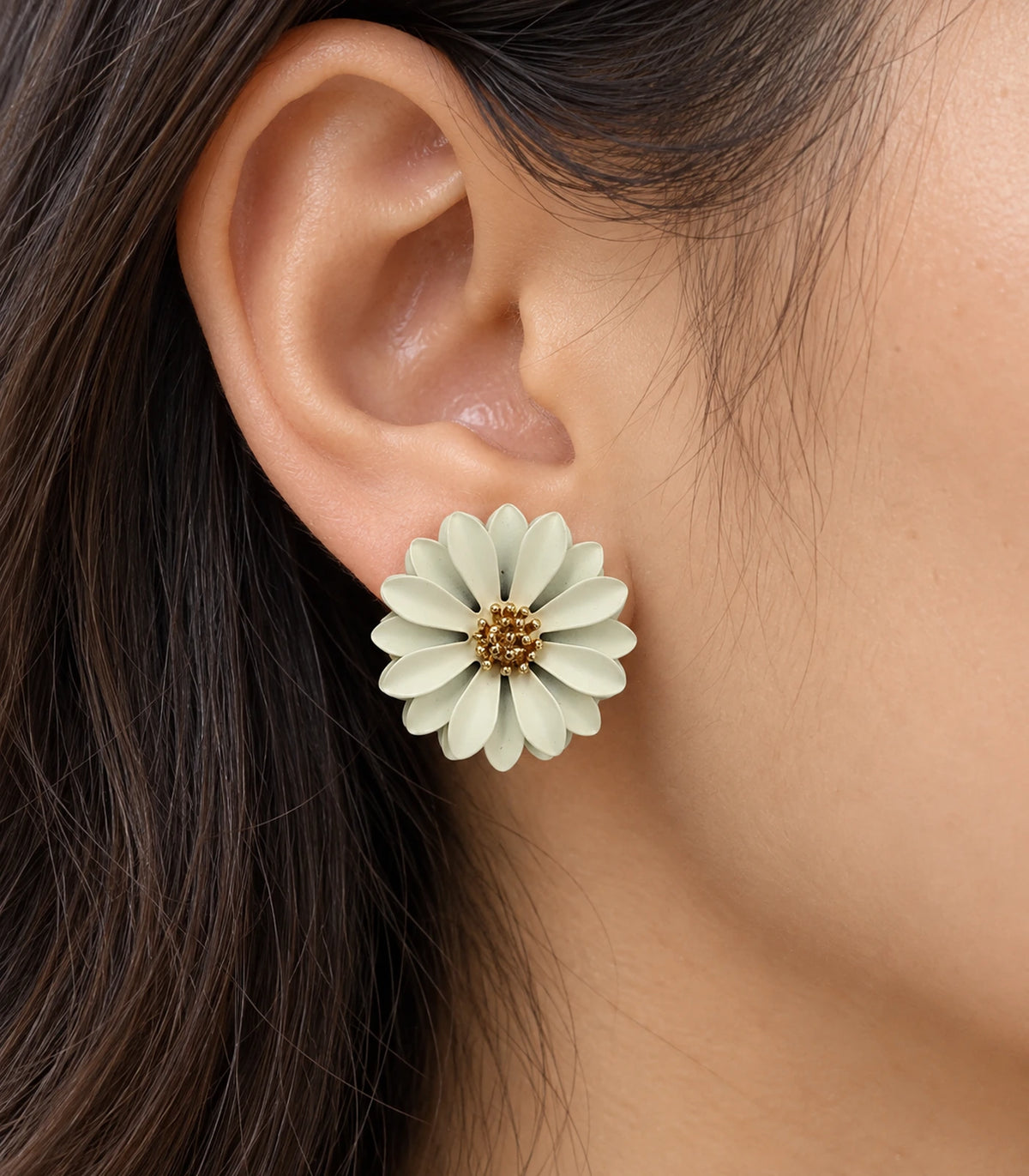 JIMIKI Ivory layered starburst daisy stud earrings, close-up of layered petals and gold-tone centre #color_ivory
