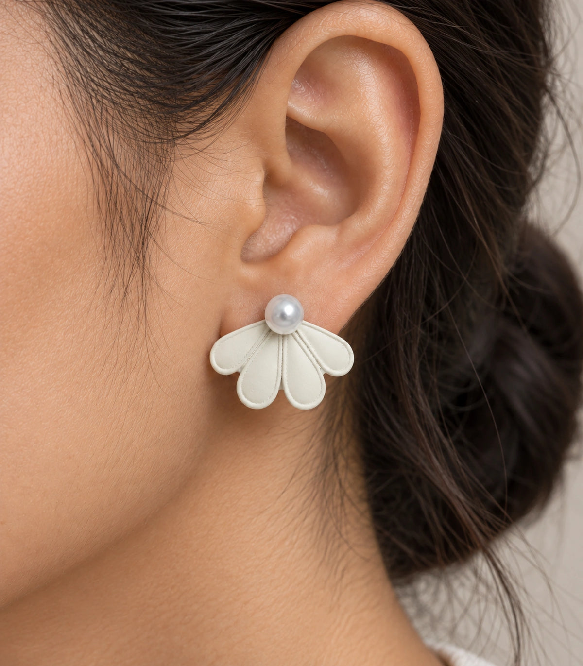 JIMIKI Ivory pearl fan petal stud earrings, worn closeup of four petals and pearl-style bead #color_ivory
