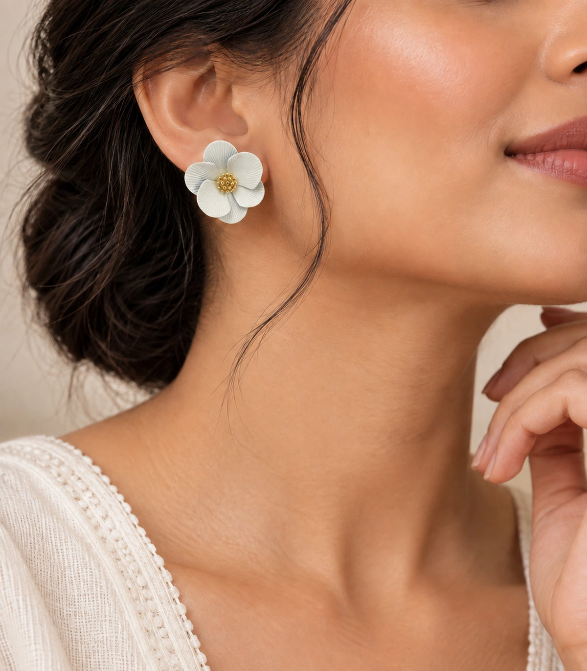 JIMIKI Ivory ribbed flower stud earrings, styled worn editorial view #color_ivory