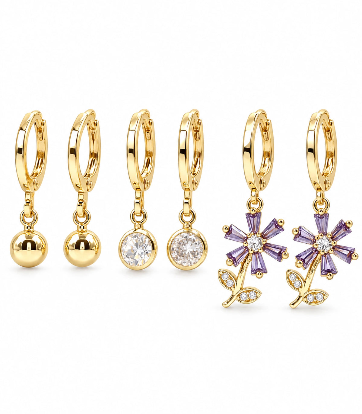 Complete gold-tone three-pair hoop earring set with ball, clear crystal and purple flower charms, six earrings