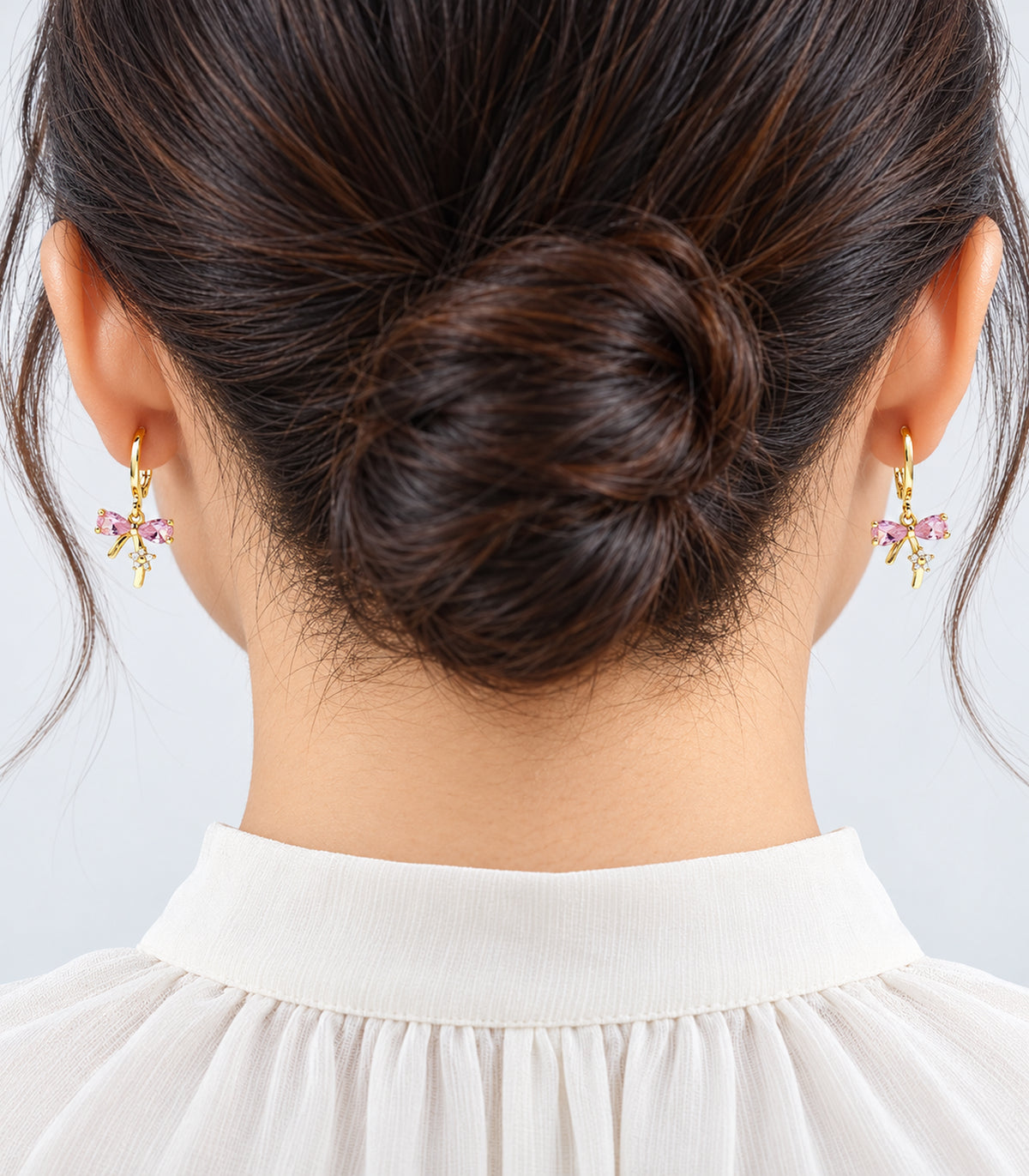Gold-tone charm hoop earrings shown worn