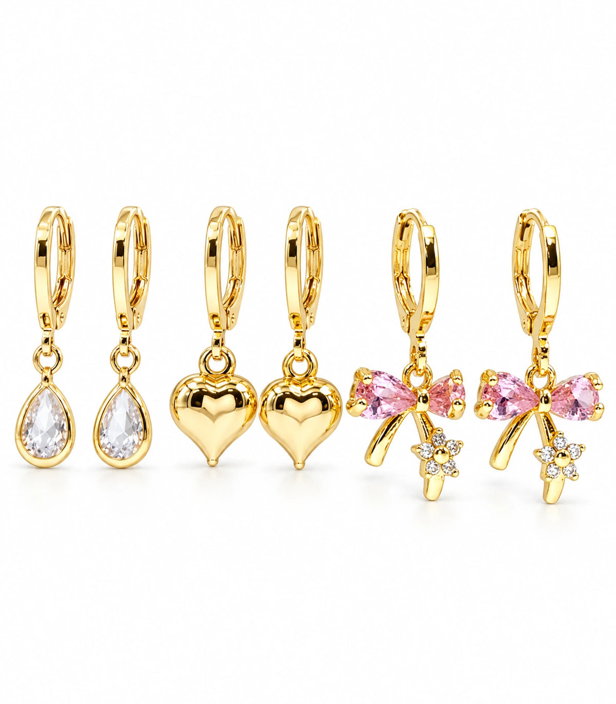 Complete three-pair gold-tone hoop earring set with clear teardrops, puffed hearts and pink crystal bows