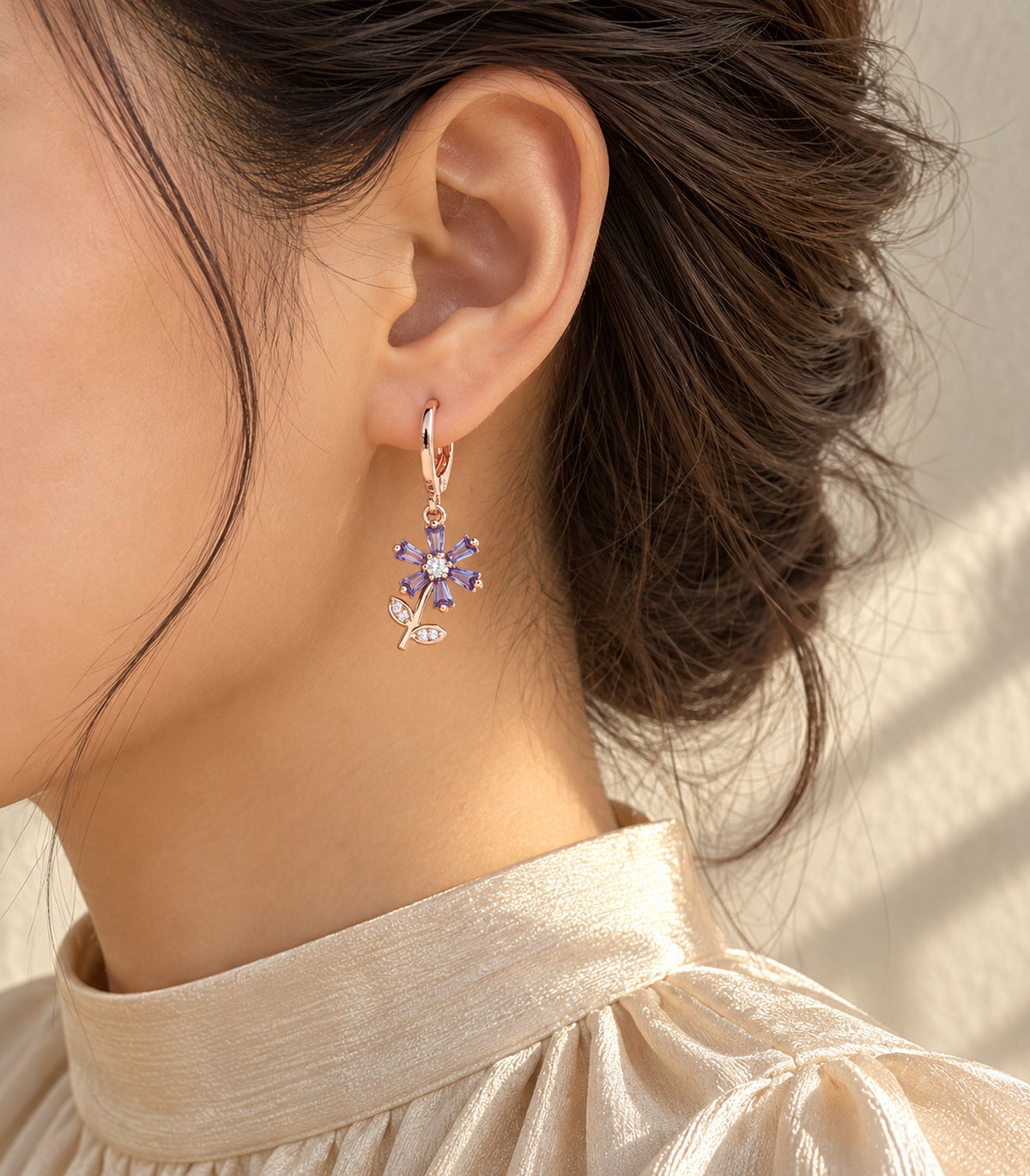 JIMIKI rose gold tone three-pair ball, crystal and purple flower hoop earring set — editorial-model