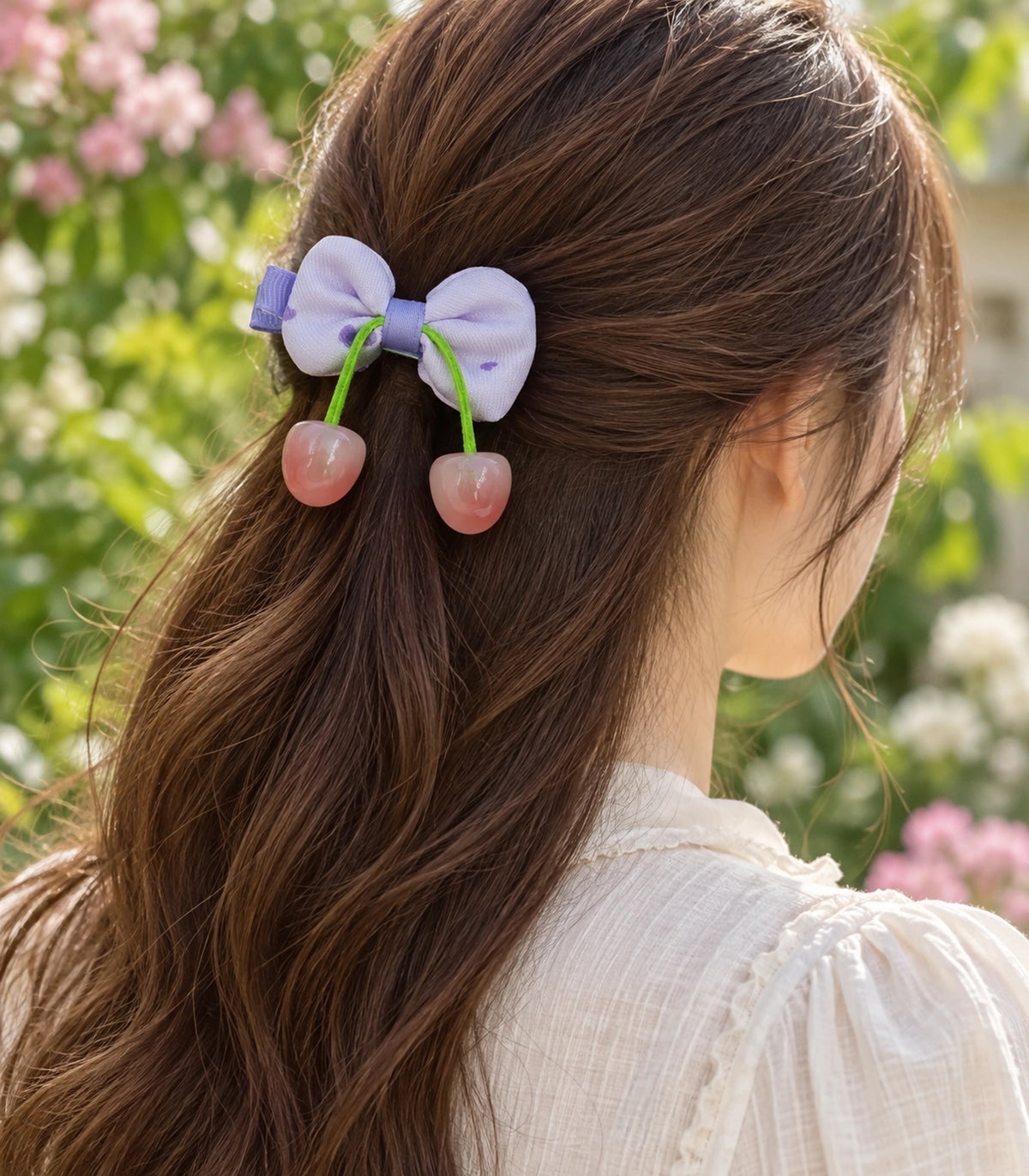 JIMIKI Lavender Bow Hair Clip with Cherry Charms in Lavender, editorial model view