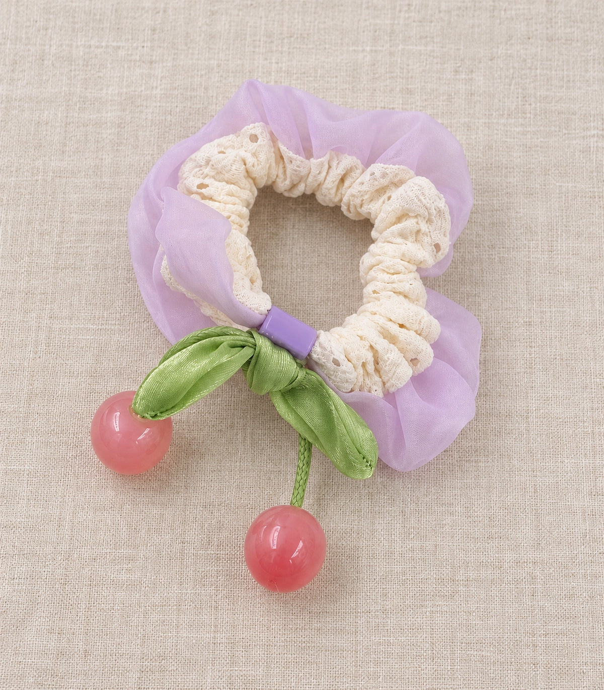 JIMIKI Lace Scrunchie With Cherry Charms in Lavender, editorial flat lay #color_lavender