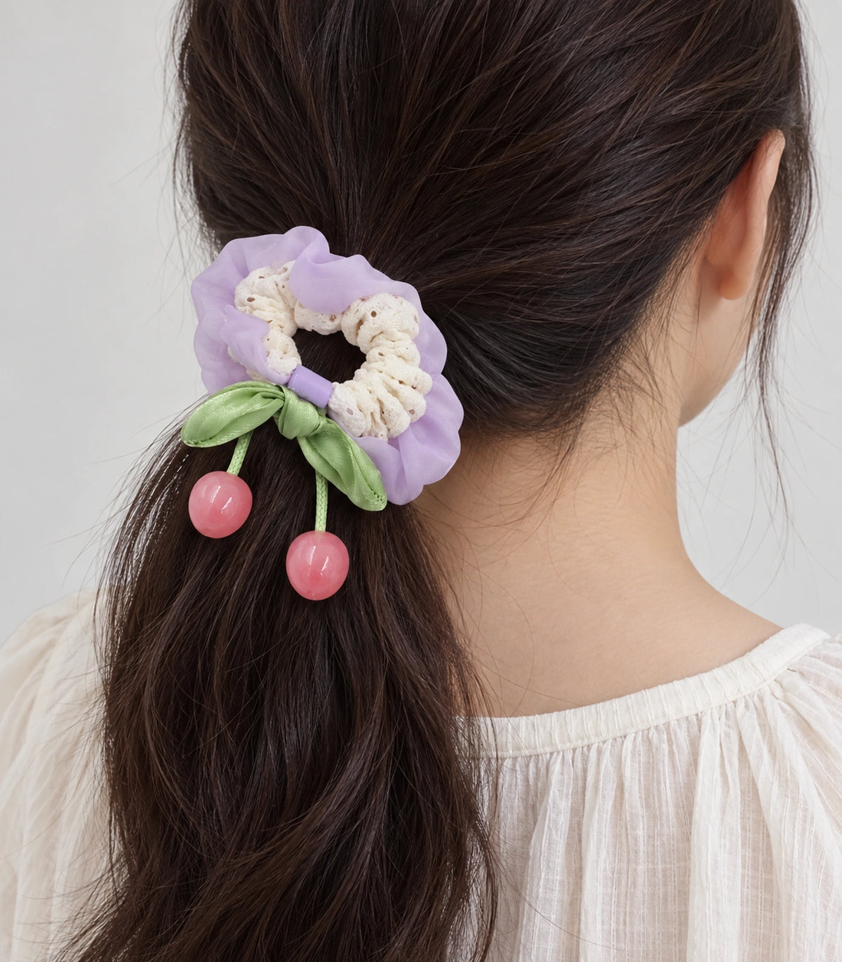 JIMIKI Lace Scrunchie With Cherry Charms in Lavender, model wearing view #color_lavender