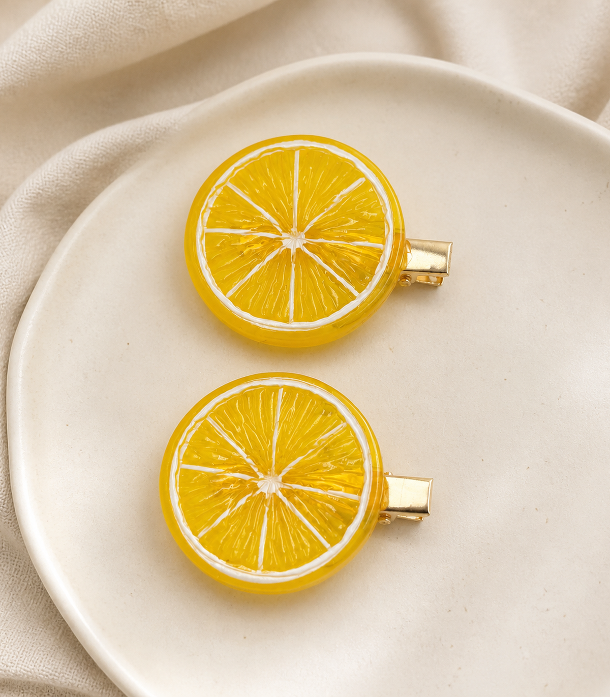 Lemon Slice Barrette Pair editorial flat lay