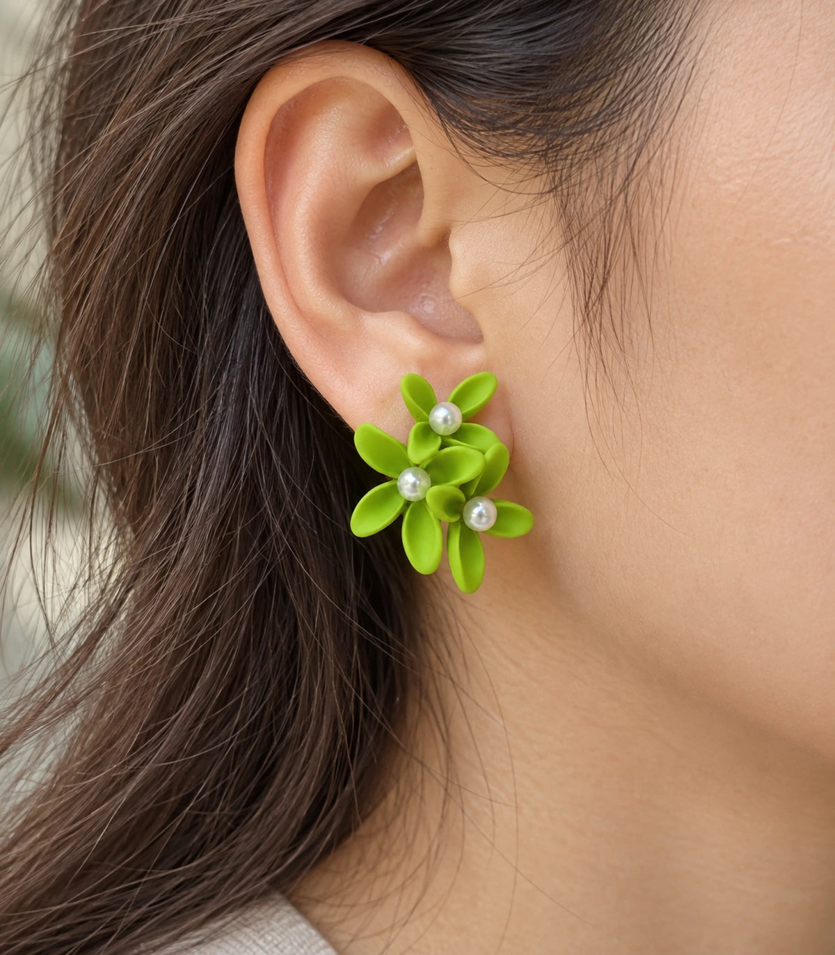 JIMIKI Lime cascading floral cluster stud earrings, close-up of the three pearl-like centres and curved petals #color_lime