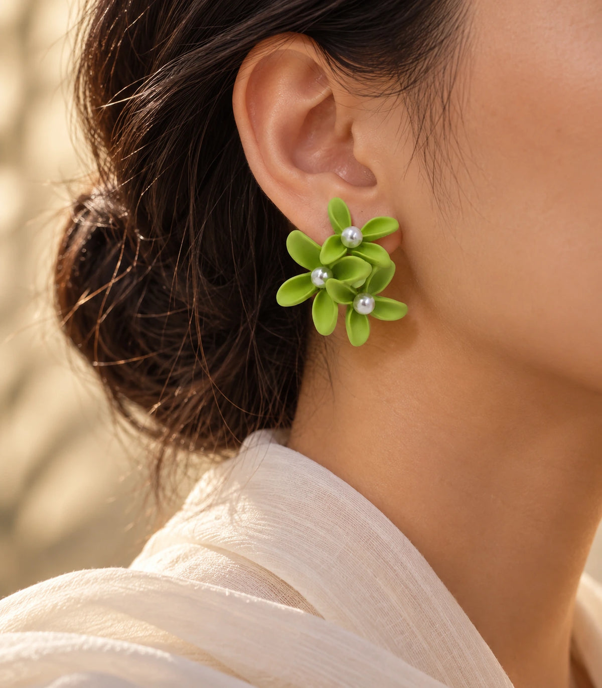 JIMIKI Lime cascading floral cluster stud earrings, worn with softly lit editorial styling #color_lime