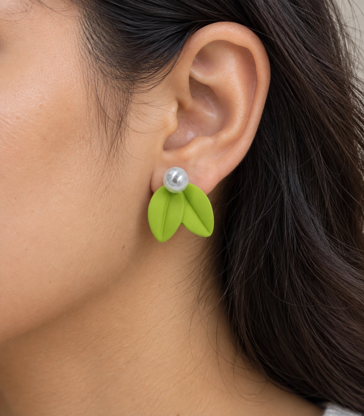 JIMIKI Double Leaf Pearl Stud Earrings in Lime Green — close-up of the earring worn on the ear #color_lime green