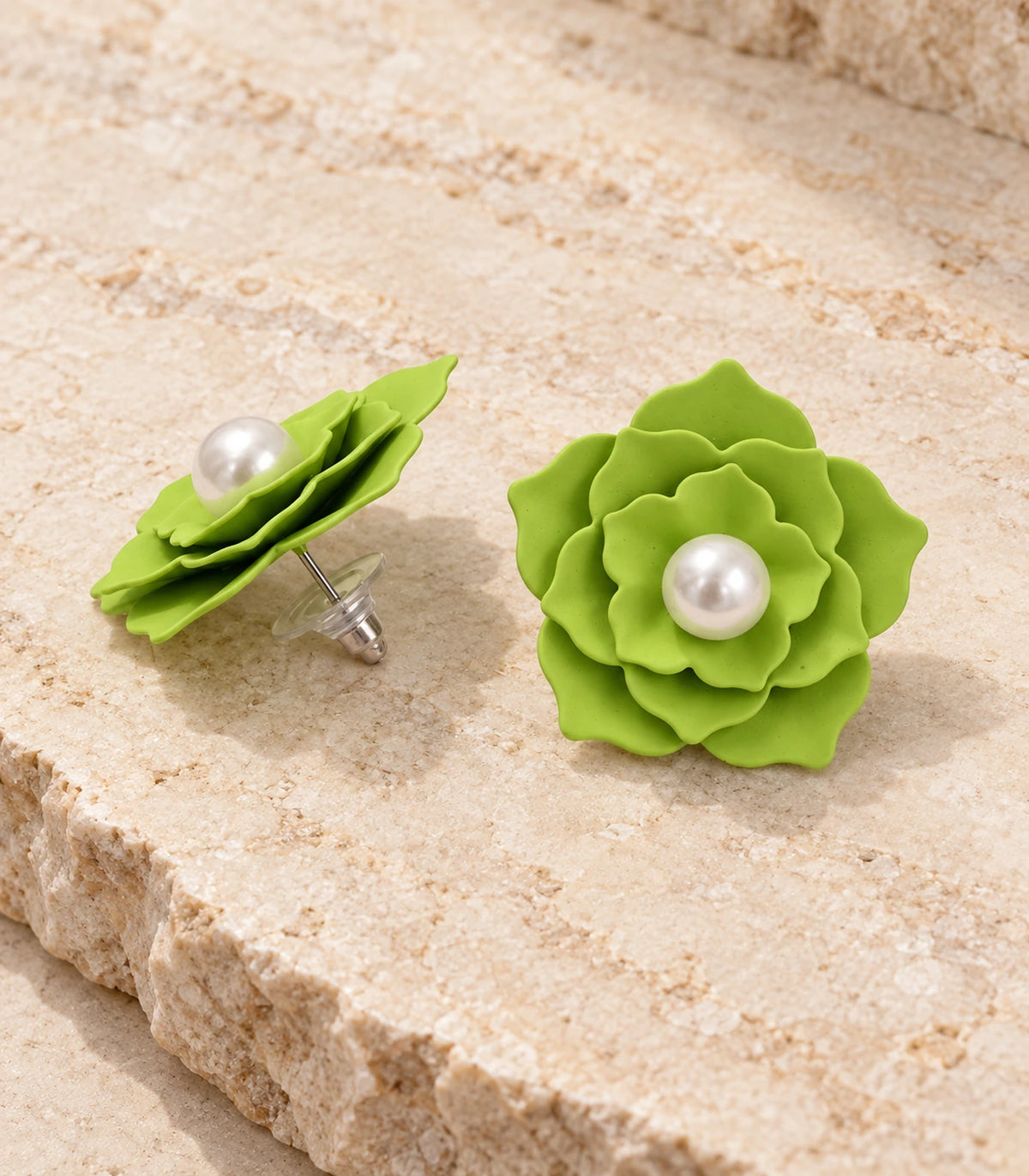 JIMIKI Layered Flower Pearl Stud Earrings, Lime Green — pair in a styled flat lay #color_lime green