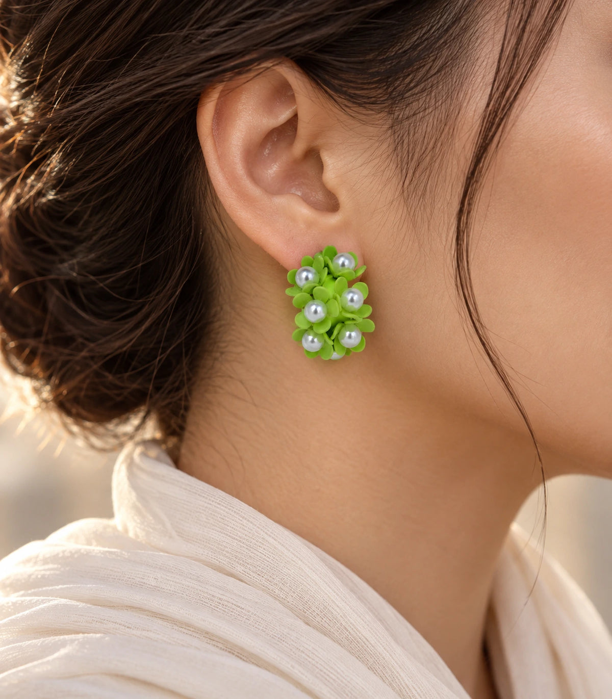 JIMIKI Lime pearl flower hoop earrings, worn with softly lit editorial styling #color_lime