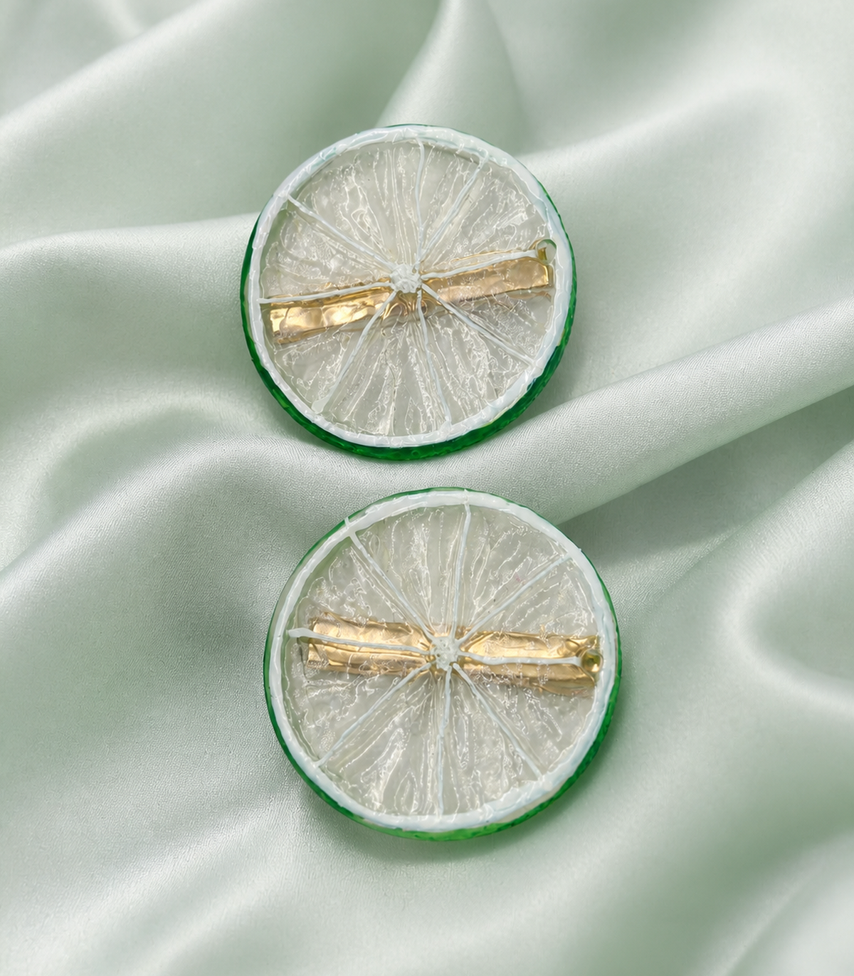 JIMIKI Translucent Lime Slice Barrette Pair in Clear / Green, close-up detail