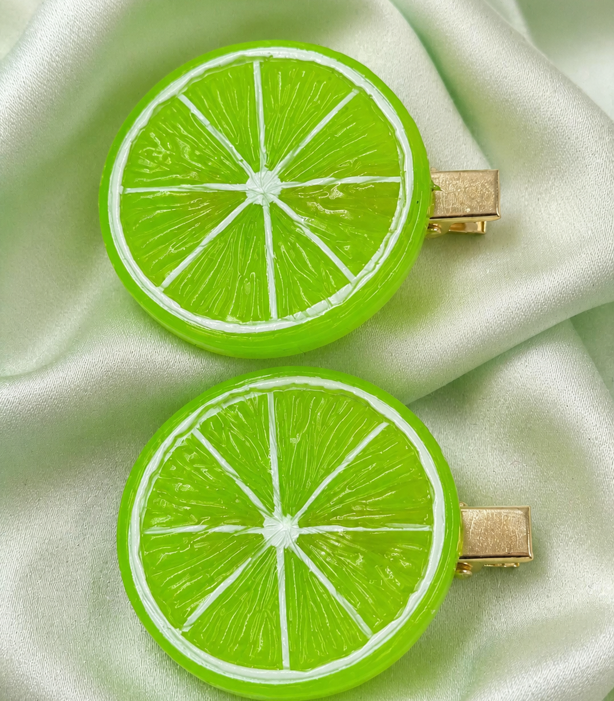 JIMIKI Bright Green Lime Slice Barrette Pair in Lime Green, close-up detail
