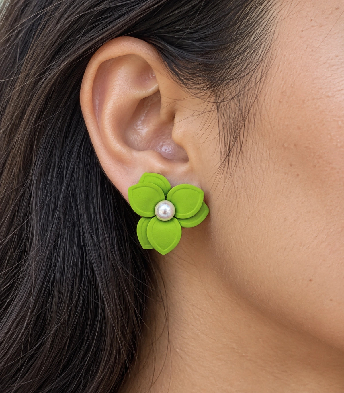 JIMIKI Lime Triple Petal Pearl Flower Stud Earrings - layered petals and pearl-style centre worn close-up #color_lime