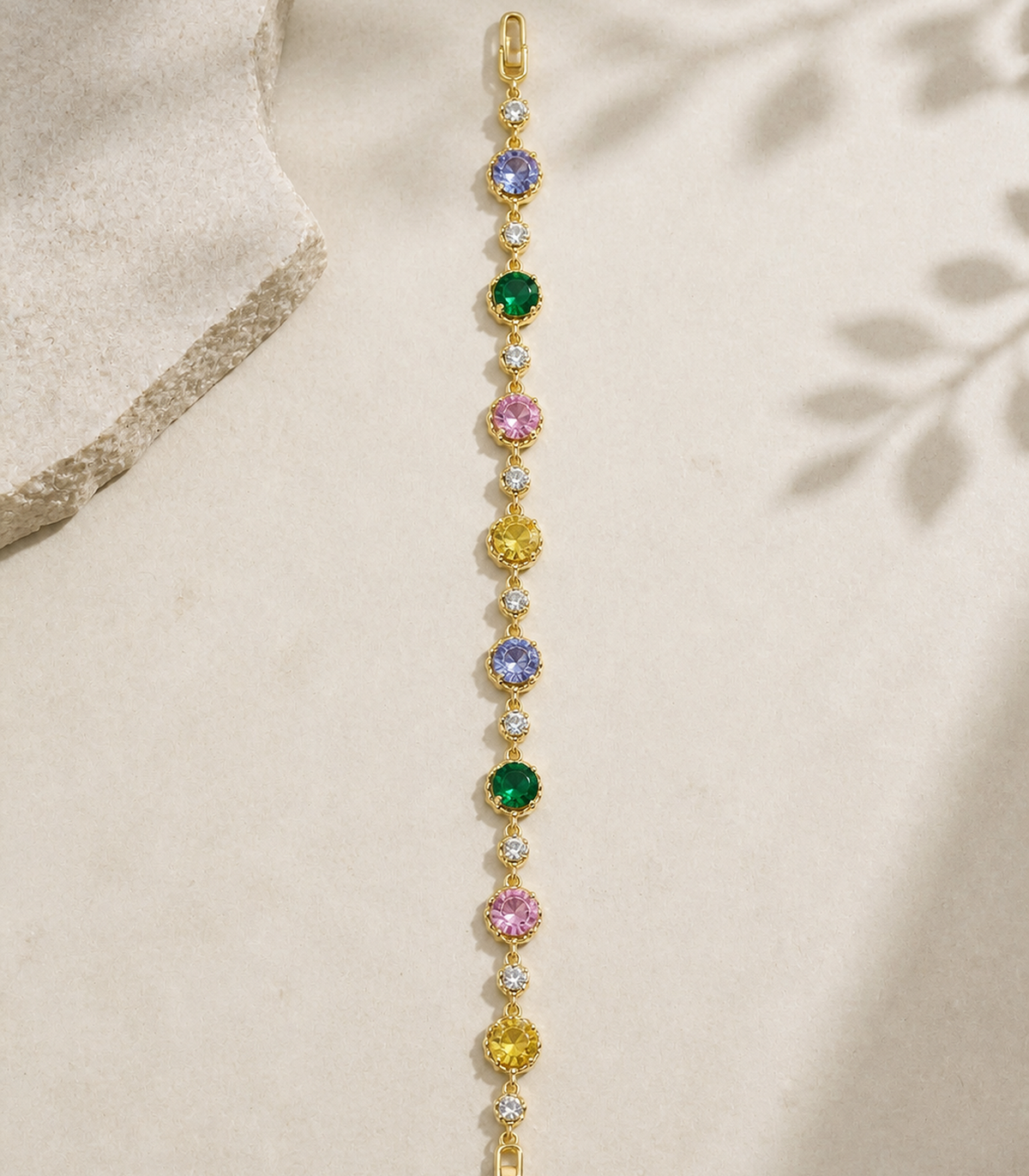 Multicolor Round Crystal Link Bracelet in an editorial flat lay