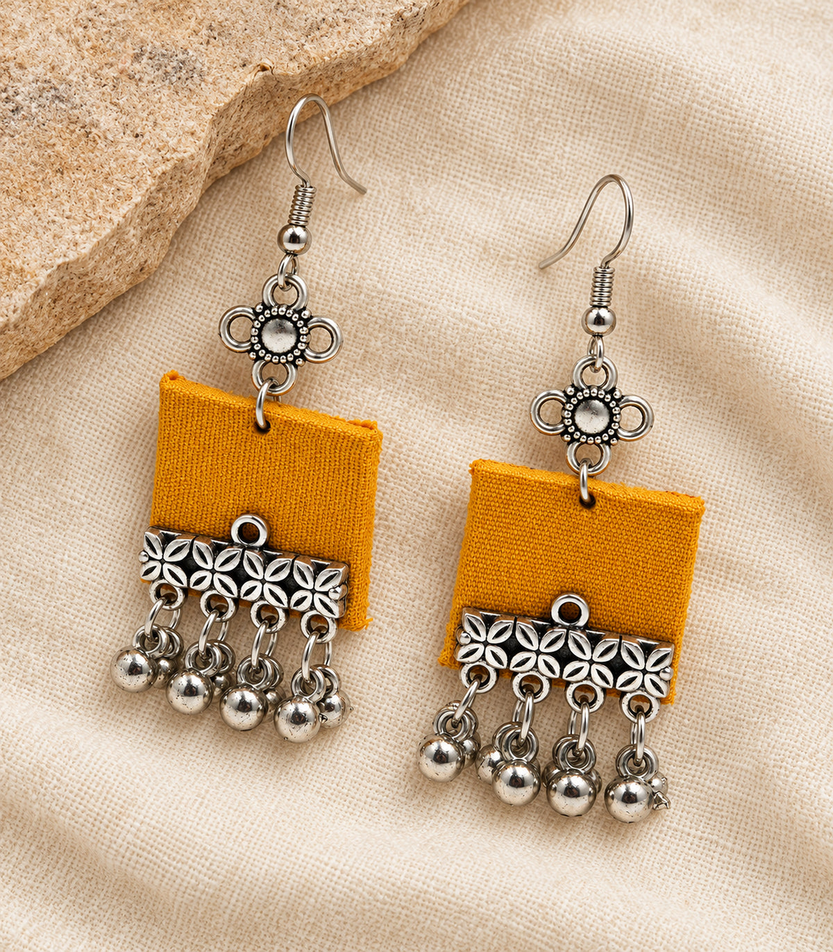 Mustard Square Fabric Ghungroo Earrings – editorial flatlay