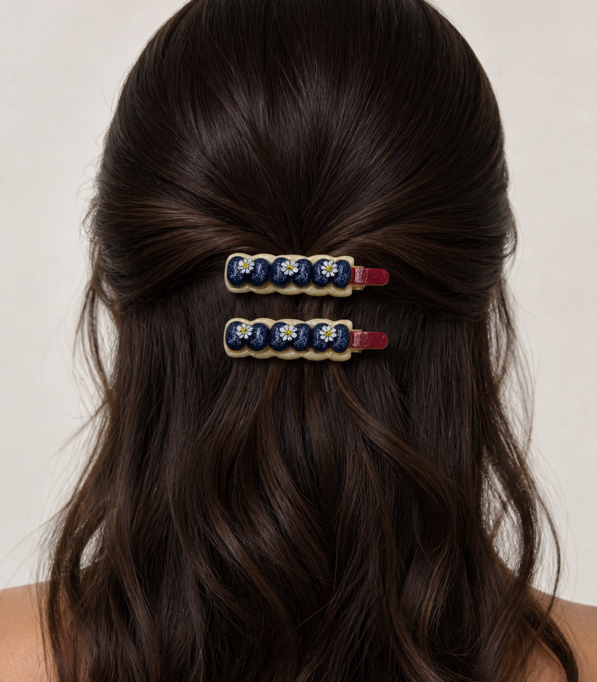 Navy Blueberry Daisy Garland Clip Pair in a styled editorial view