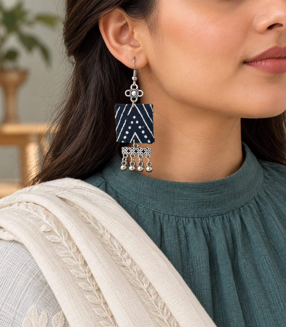 Navy and ivory square floral fringe fabric earrings — editorial model view