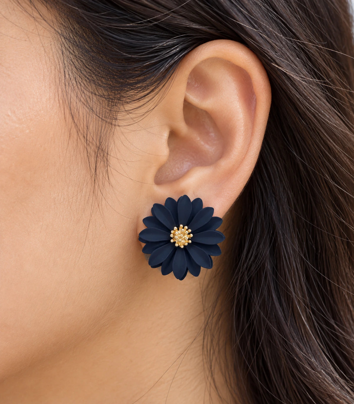 JIMIKI Navy layered starburst daisy stud earrings, close-up of layered petals and gold-tone centre #color_navy