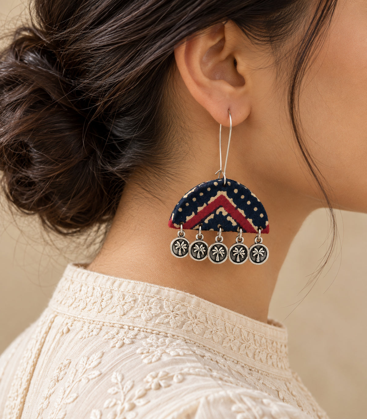 Navy and maroon chevron fabric coin drop earring styled with ivory clothing