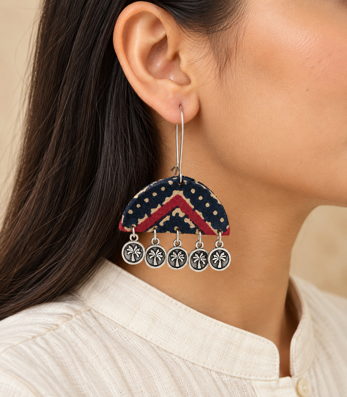 Navy and maroon chevron fabric coin drop earring worn in side profile