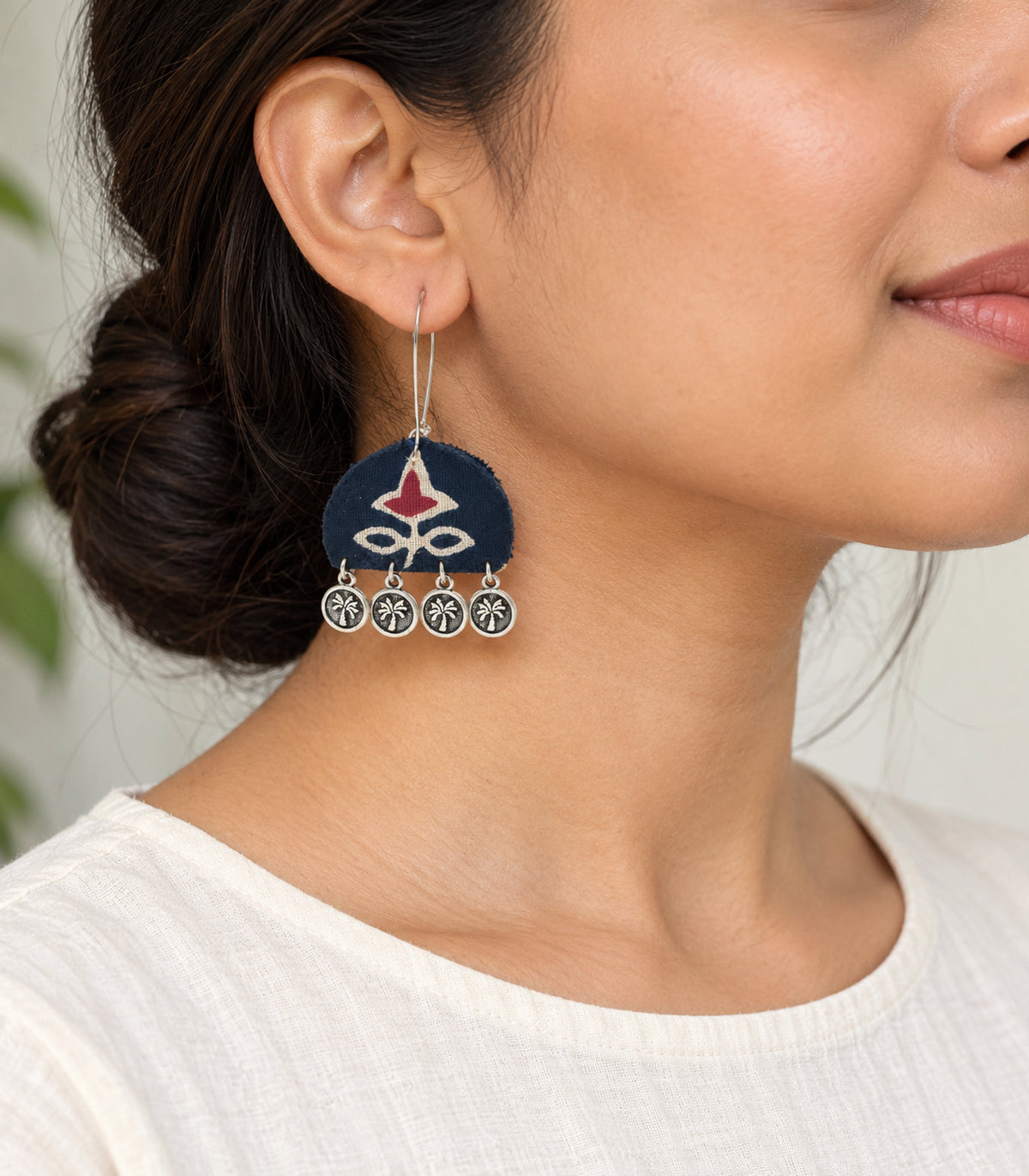 Navy and maroon floral coin drop earrings — model view