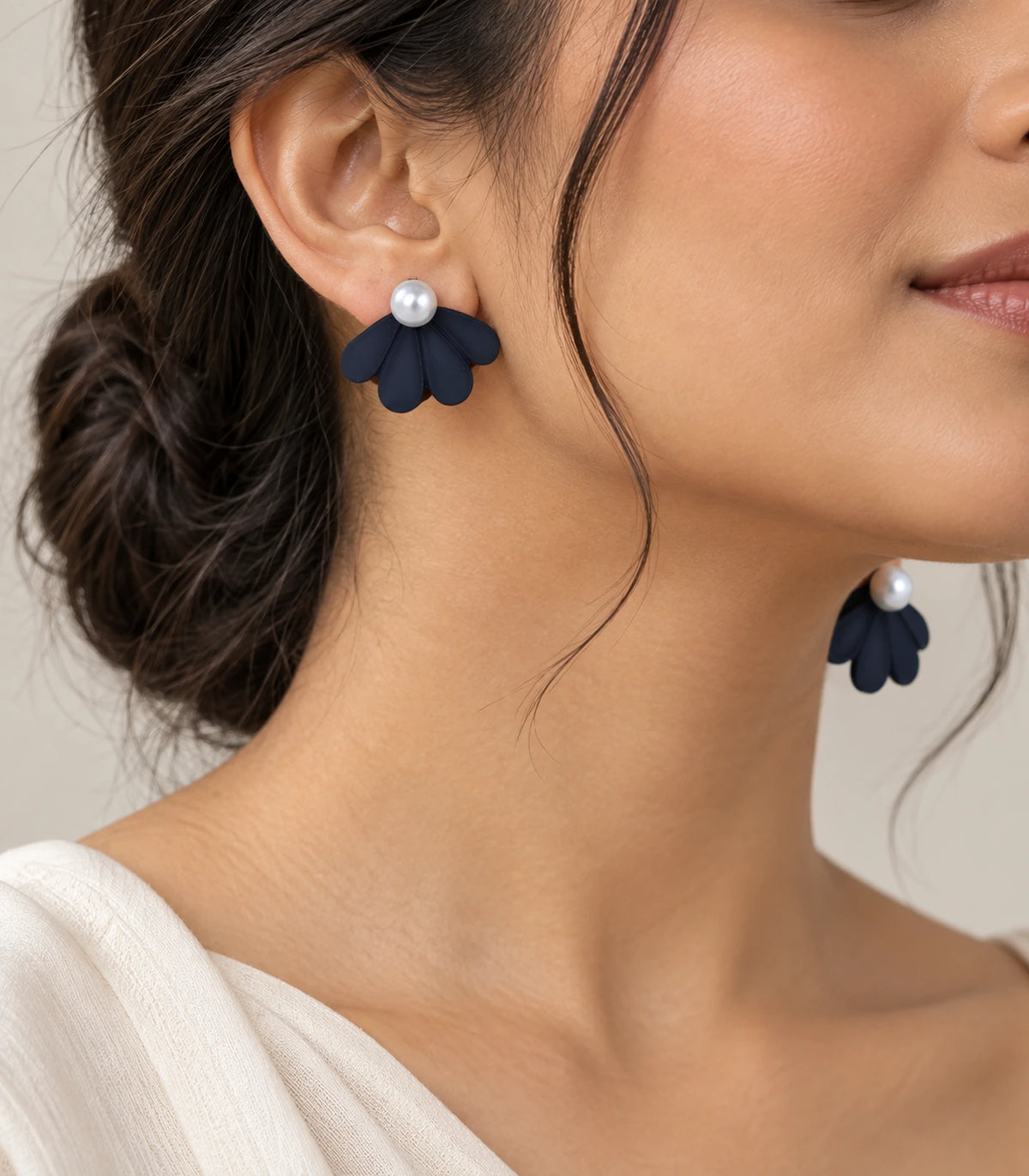JIMIKI Navy pearl fan petal stud earrings, styled worn editorial view #color_navy