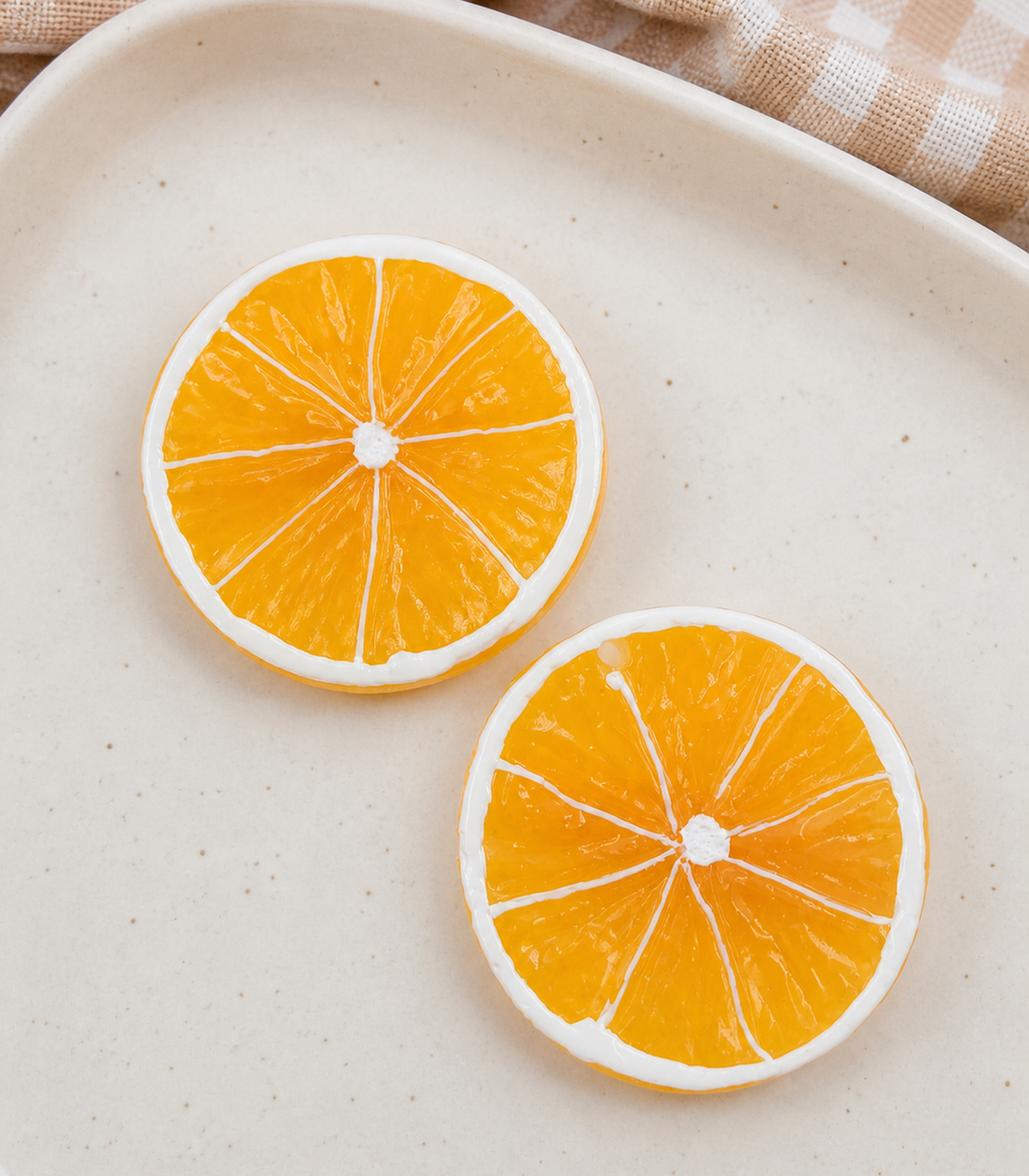 Orange Slice Barrette Pair editorial flat lay