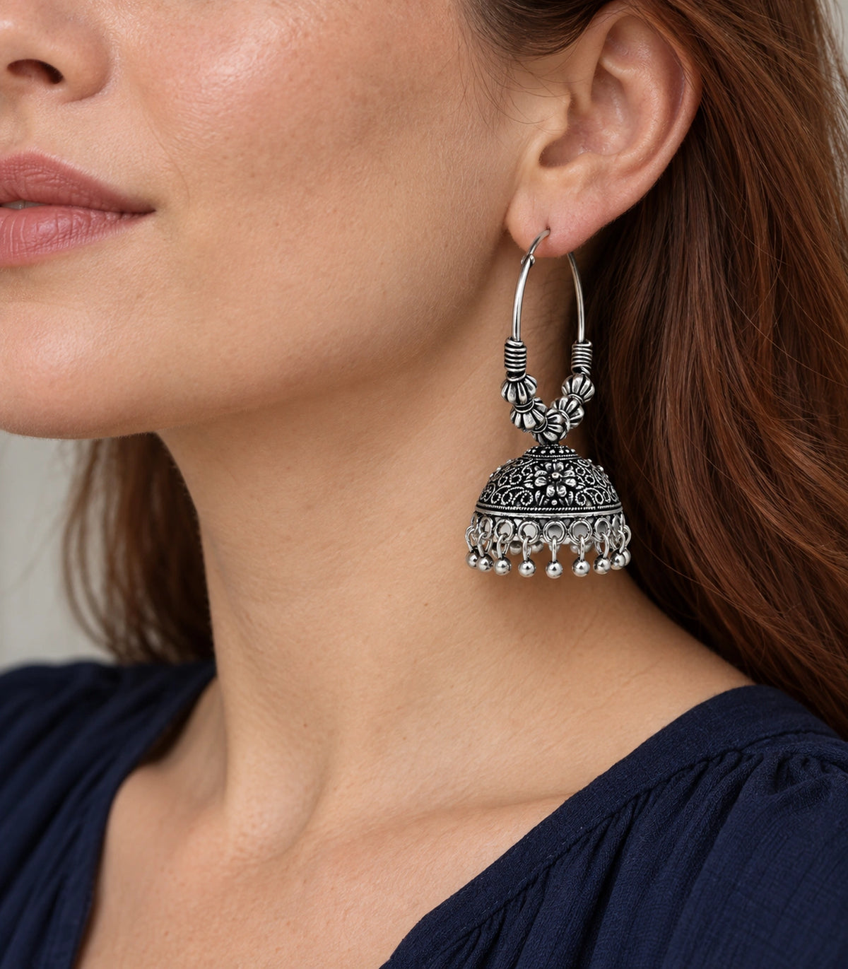 JIMIKI Beaded Hoop Floral Jhumka Earrings - Oxidized Silver earring worn by a model #color_oxidized-silver