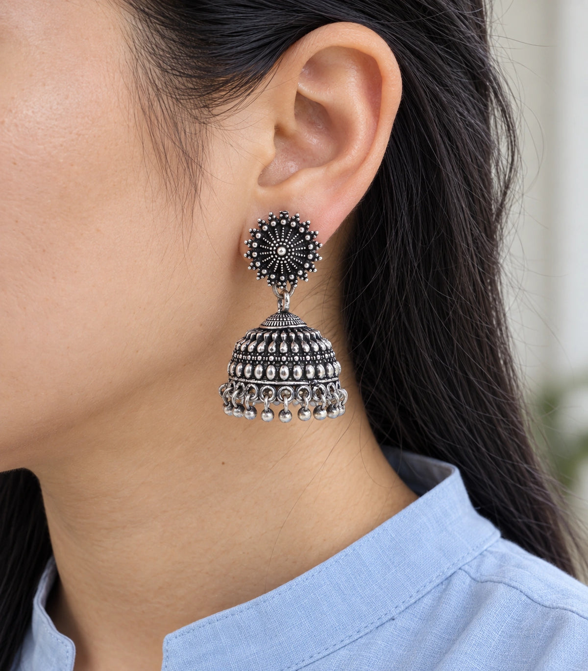 JIMIKI Oxidized Silver Beaded Sunburst Jhumka Earrings - close-up of the earring worn #color_oxidized-silver