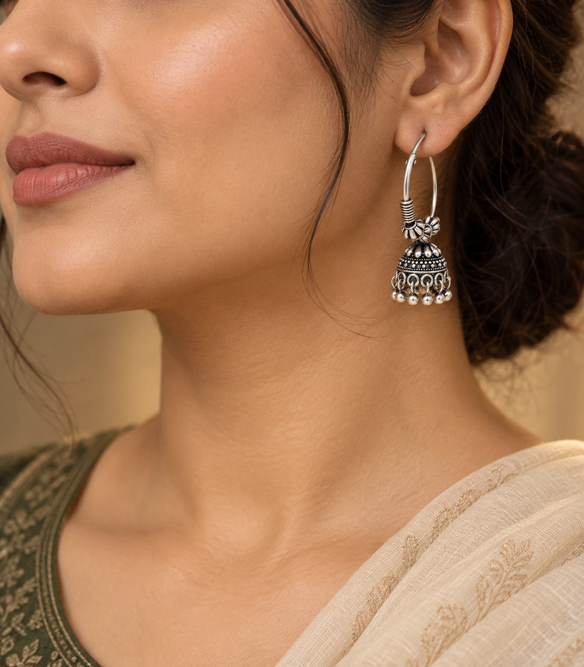 JIMIKI Oxidized Silver Floral Hoop Jhumka Earrings - editorial styling with hair swept back #color_oxidized-silver