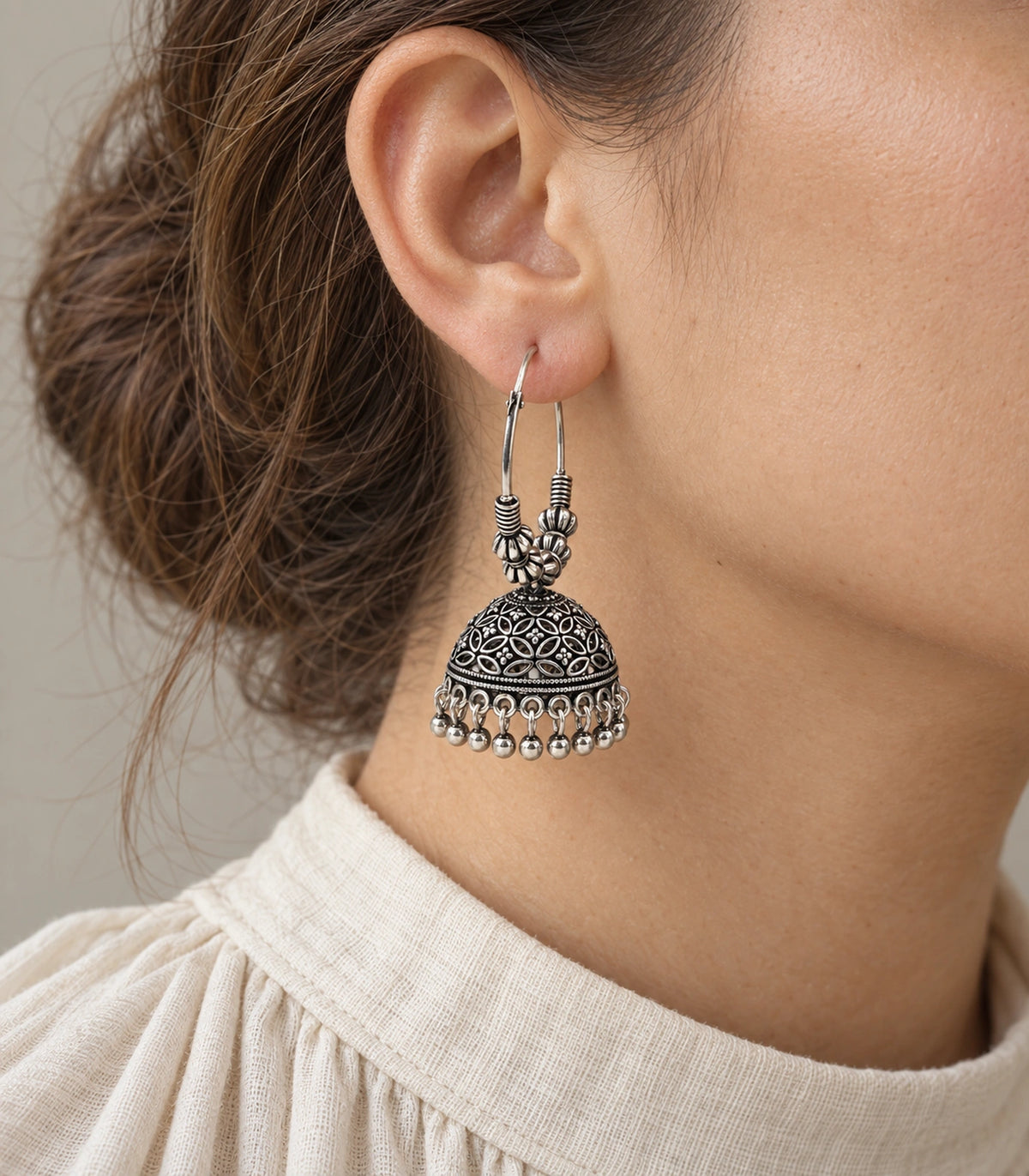 JIMIKI Oxidized Silver Floral Lattice Beaded Hoop Jhumka Earrings - Worn styling view #color_oxidized-silver