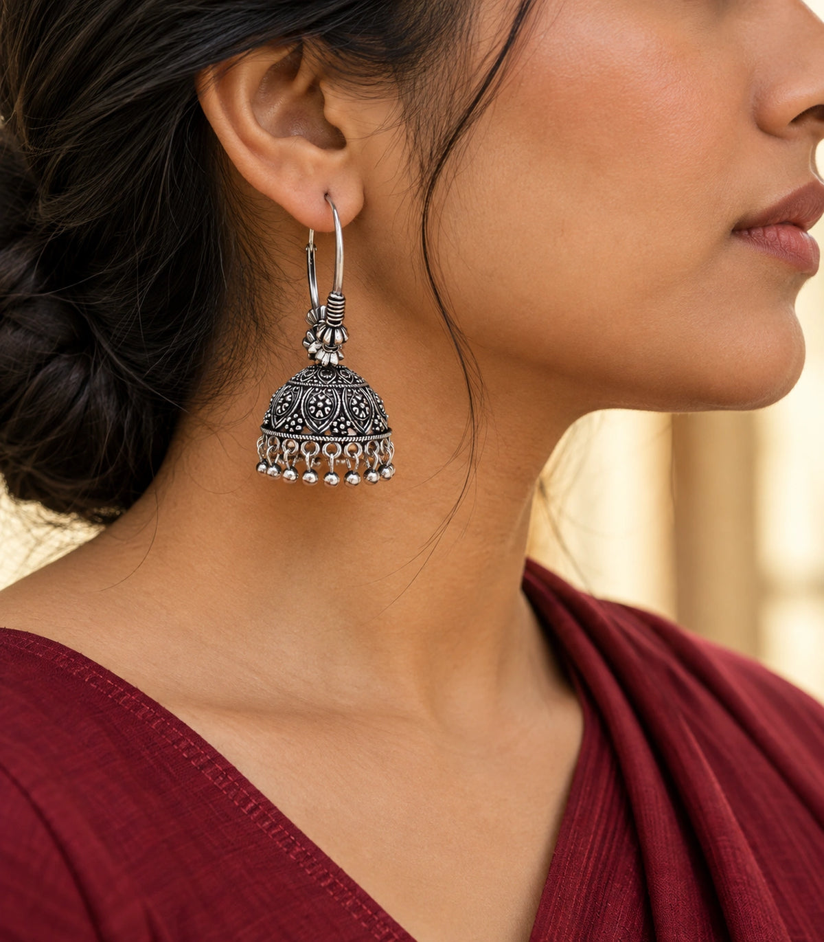 JIMIKI Oxidized Silver Floral Paisley Hoop Jhumka Earrings - editorial styling with hair swept back #color_oxidized-silver
