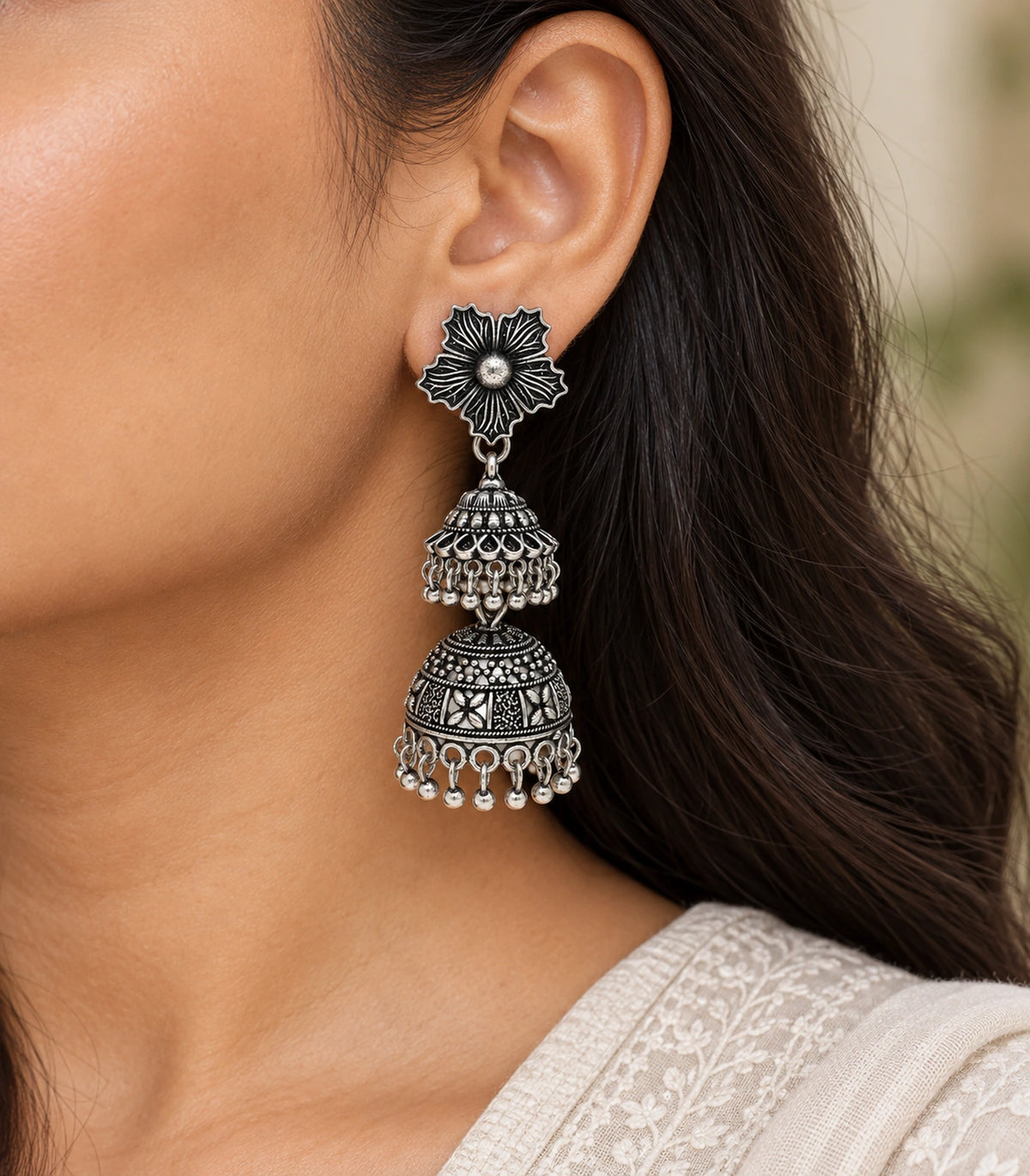 JIMIKI Oxidized Silver Hibiscus Double Jhumka Earrings - earrings worn with cream clothing #color_oxidized-silver