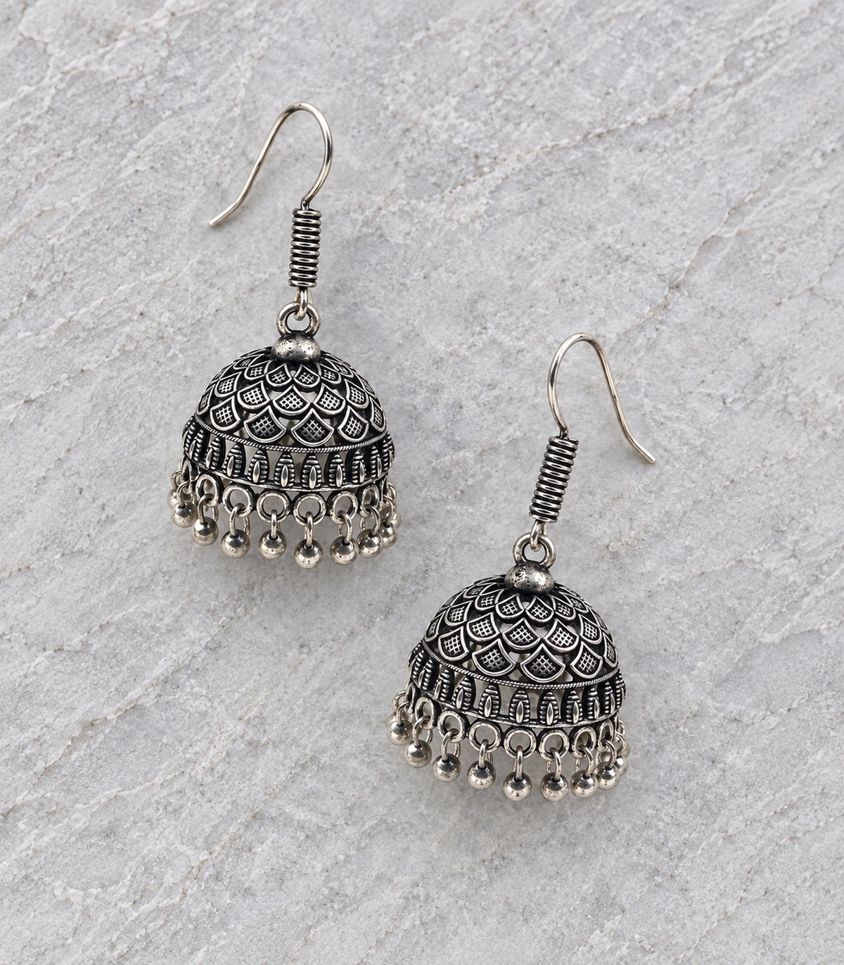 JIMIKI Oxidized Silver Layered Leaf Scale Hook Jhumka Earrings in Oxidized Silver - editorial flatlay #color_oxidized-silver