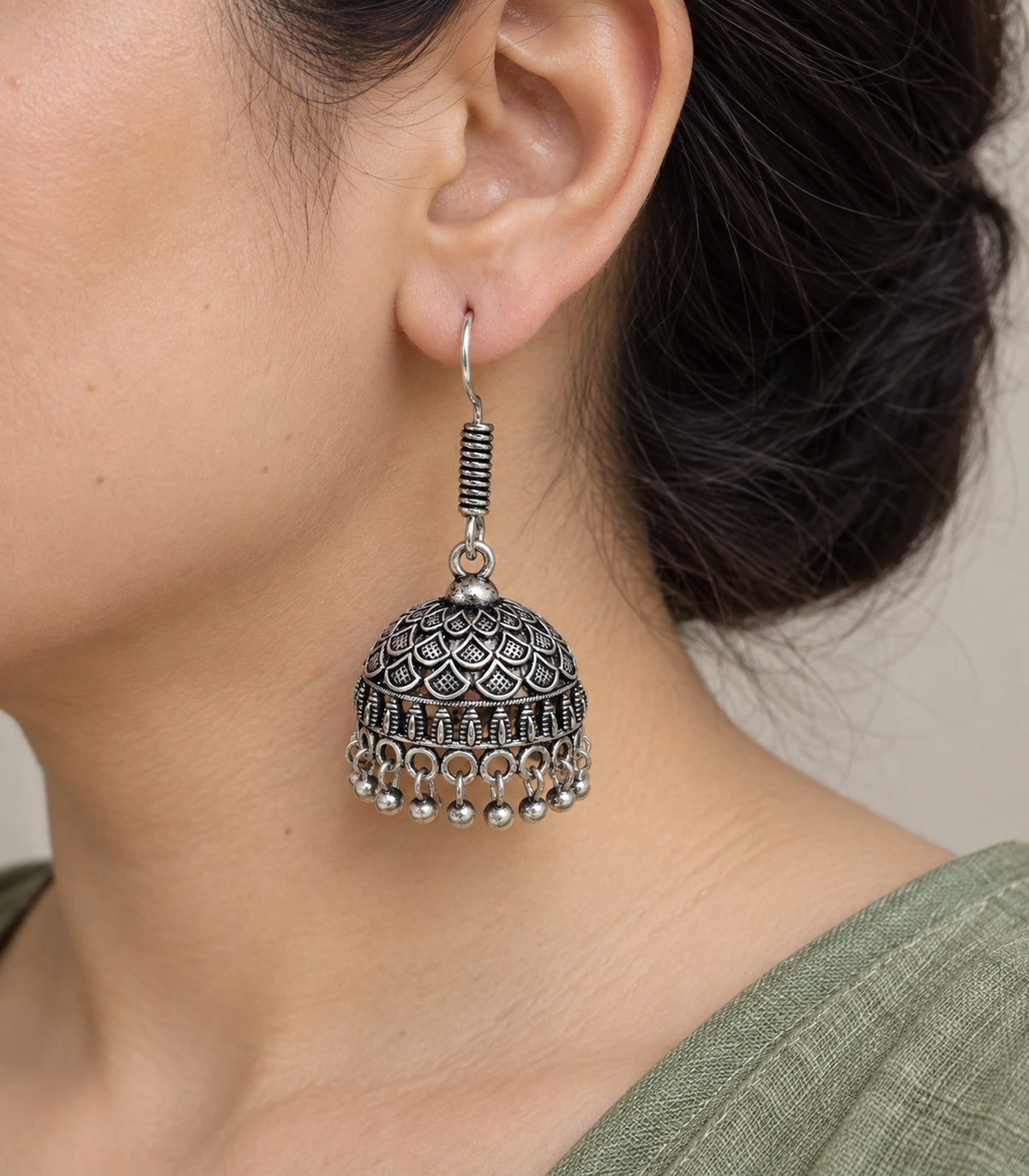 JIMIKI Oxidized Silver Layered Leaf Scale Hook Jhumka Earrings in Oxidized Silver - worn styling view #color_oxidized-silver