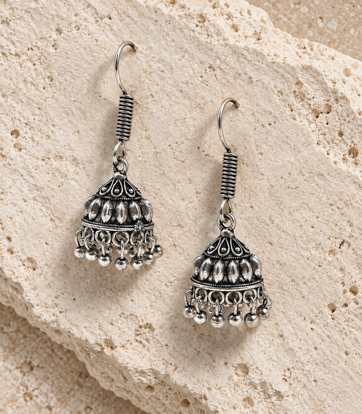 JIMIKI Leaf Dome Hook Jhumka Earrings in Oxidized Silver - editorial flatlay #color_oxidized-silver