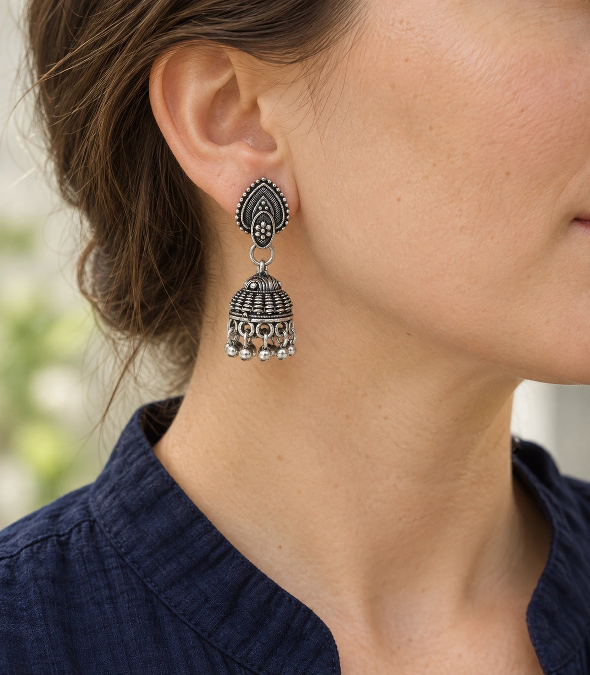 JIMIKI Leaf Stud Beaded Jhumka Earrings - Oxidized Silver earring worn with a clear view of the design #color_oxidized-silver