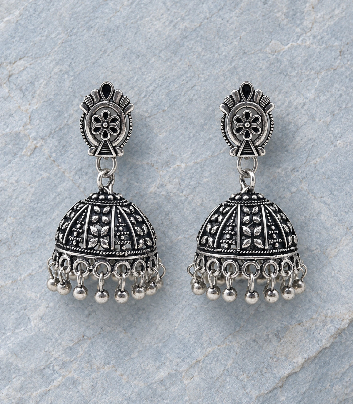 JIMIKI Oxidized Silver Oval Flower Stud Panel Jhumka Earrings in Oxidized Silver - editorial flatlay #color_oxidized-silver